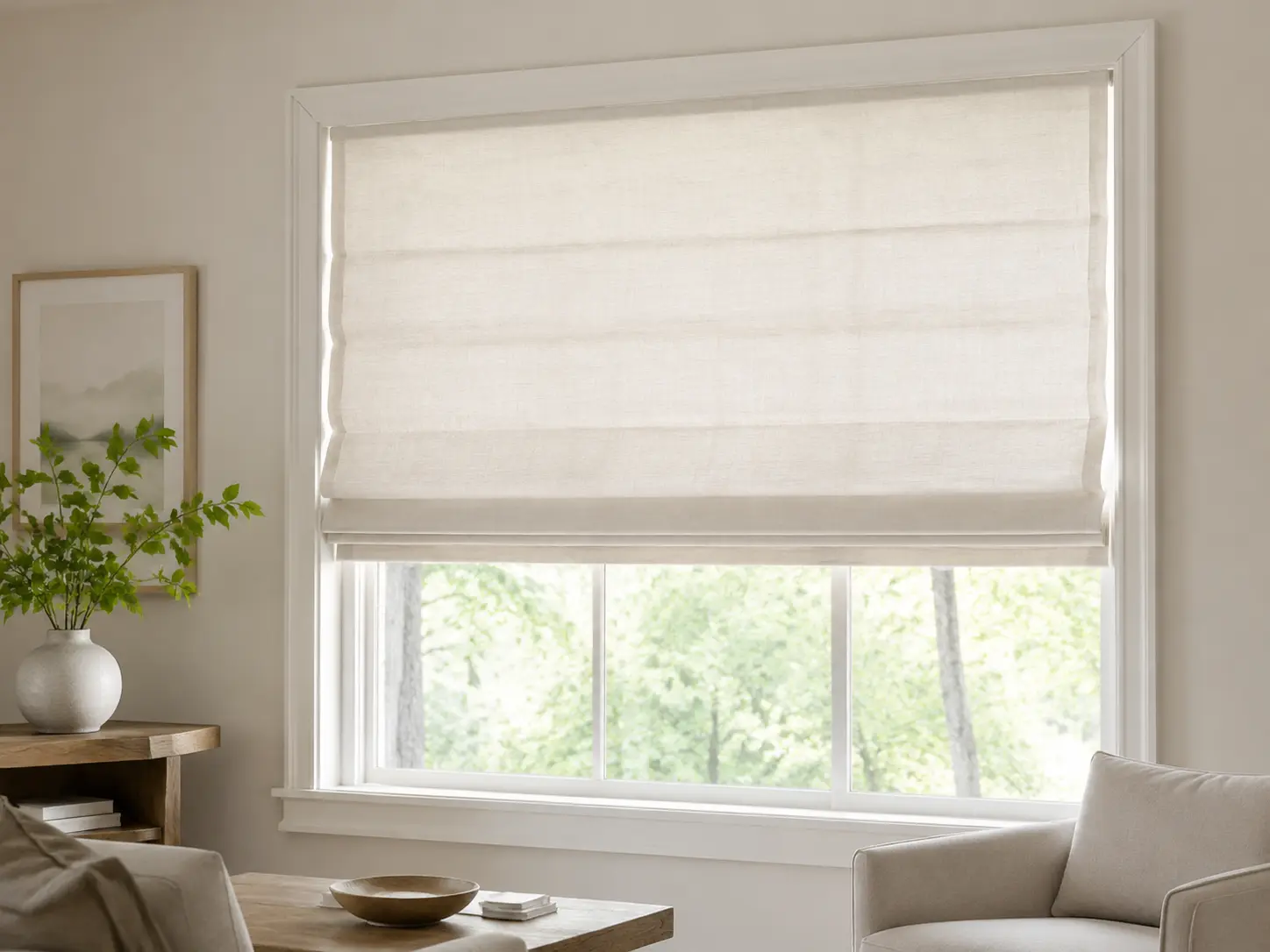 Tailored ivory Roman shade with soft horizontal fabric folds