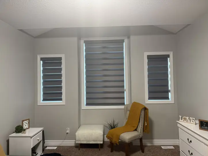 Three Zebra shades adjusted for greater privacy